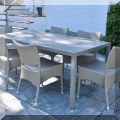 L04. Janus metal dining table with 6 all weather wicker chairs. 28.5"h x 72"w x 37"d 